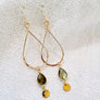 Megen Gabrielle Jewelry | labradorite jewelry, 14k gold fill jewelry. dangle earrings. 14K gold fill earrings. sparkly earrings. Labradorite stone jewelry, natural stone jewelry. Labradorite drop hoop earrings. labradorite hoop earrings. Gold filled labradorite hoop earrings. gold labradorite hoop earrings. gold earrings with labradorite.