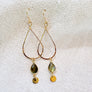 Megen Gabrielle Jewelry | labradorite jewelry, 14k gold fill jewelry. dangle earrings. 14K gold fill earrings. sparkly earrings. Labradorite stone jewelry, natural stone jewelry. Labradorite drop hoop earrings. labradorite hoop earrings. Gold filled labradorite hoop earrings. gold labradorite hoop earrings. gold earrings with labradorite.