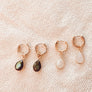 Megen Gabrielle Jewelry | Labradorite and Moonstone Huggie dangle earrings. huggie earrings. minimal huggie earrings. huggie earrings with charms. 14k gold fill huggie earrings. triangle charm huggie earrings, dagger huggie earrings. Leaf charm huggie earrings, petal charm huggie earrings. square charm huggie earrings, hammered square charm earrings. circle charm huggie earrings, circle dangle charm huggie earrings. 14k gold fill earrings. huggie hoop earrings, 14k gold fill huggie hoop earrings.