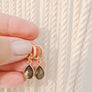 Megen Gabrielle Jewelry | Labradorite and Moonstone Huggie dangle earrings. huggie earrings. minimal huggie earrings. huggie earrings with charms. 14k gold fill huggie earrings. triangle charm huggie earrings, dagger huggie earrings. Leaf charm huggie earrings, petal charm huggie earrings. square charm huggie earrings, hammered square charm earrings. circle charm huggie earrings, circle dangle charm huggie earrings. 14k gold fill earrings. huggie hoop earrings, 14k gold fill huggie hoop earrings.