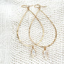 Megen Gabrielle Jewelry | 14k gold fill jewelry. 14k gold fill earrings, pearl earrings. gold and pearl earrings. dangle pearl earrings. coin pearl earrings. gold filled earrings, gold earrings. pearl earrings. pearl hoop earrings for women. pearl drop hoop earrings for women.