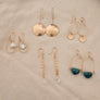 Megen Gabrielle Jewelry | 14k gold fill jewelry. 14k gold fill earrings, pearl earrings. gold and pearl earrings. dangle pearl earrings. coin pearl earrings. gold filled earrings, gold earrings. pearl earrings. gold hoop earrings for women. pearl drop hoop earrings for women.