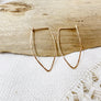 Megen Gabrielle Jewelry | Pointed Oval Hoop Earrings. Classic hoop earrings with closure, shaped in a pointed oval shape in 14K gold fill. 14K gold filled hoop earrings, pointed hoop earrings, classic hoop earrings, hoop earrings, gold hoop earrings