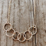 Megen Gabrielle Jewelry | circles necklace, chain and pendaendt circle necklace. 14k gold fill necklace. gold necklace. family necklace. loved ones necklace. necklace. significant other necklace