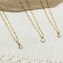 Megen Gabrielle Jewelry | 14K gold filled jewelry. gold filled jewelry, 14K gold fill necklace, gold filled necklace. CZ drop gold filled necklace. CZ necklace. Cubic Zirconia necklace. womens CZ necklace, CZ necklace for ladies, 14k gold filled necklace with cz stone drop. gold necklace with CZ stone drop. Gold cz stone necklace for ladies. gold CZ necklace for women. Gold CZ necklace for men. gold necklace for women. gold filled necklace for women.