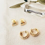 Megen Gabrielle Jewelry | 18K gold filled huggie earrings. huggie hoop earrings. simple huggie earrings. everyday earrings. Gold filled huggie earrings. circle huggie earings, square huggie earrings. comfortable earrings, every day wear.