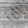 Megen Gabrielle Jewelry | Geometric diamond shaped hoop earrings. diamond shaped hoop earrings. 14k gold fill hoop earrings, 14k rose gold fill earrings, sterling silver earrings. geometric gold earrings, geometric silver earrings, geometric rose gold earrings. minimalist geometric earrings. geometric gold earrings hoop. geometric hoops gold. diamond shaped earrings. silver diamond shaped earrings. rhombus shaped earrings. diamond earrings.