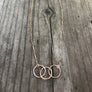 Megen Gabrielle Jewelry | circles necklace, chain and pendaendt circle necklace. 14k gold fill necklace. gold necklace. family necklace. loved ones necklace. necklace. significant other necklace