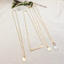 Megen Gabrielle Jewelry | 14K gold filled necklace with gold horizontal bar. Classic bar style necklace.