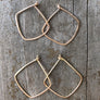 Megen Gabrielle Jewelry | Geometric diamond shaped hoop earrings. diamond shaped hoop earrings. 14k gold fill hoop earrings, 14k rose gold fill earrings, sterling silver earrings. geometric gold earrings, geometric silver earrings, geometric rose gold earrings. minimalist geometric earrings. geometric gold earrings hoop. geometric hoops gold. diamond shaped earrings. silver diamond shaped earrings. rhombus shaped earrings. diamond earrings.