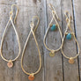Megen Gabrielle Jewelry | teardrop-shaped hoop with gold disk drop and another pair of hoops wire wrapped with a chrysocolla stone and has a little circle drop as-well.