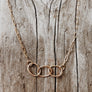 Megen Gabrielle Jewelry | circles necklace, chain and pendaendt circle necklace. 14k gold fill necklace. gold necklace. family necklace. loved ones necklace. necklace. significant other necklace