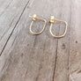 Megen Gabrielle Jewelry | rainbow earrings. 14k gold filled rainbow earrings. small rainbow earrings. U- shapped earrings. Small Sterling silver rainbow earrings. 14k rose gold filled rainbow earrings. rainbow shaped earrings.