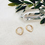 Megen Gabrielle Jewelry | Huggie earrings. 14K gold fill huggie earrings. 14K gold fill earrings. petal shapped huggie earrings. delicate huggie earrings. gold filled huggies. gold filled huggie earrings. womens huggie earrings. huggie earrings for women. gold earrings for women. gold earrrings for men. presents for women. present for women in their 30s. presents for women in their 40s. gold filled earrings women. hugg earrings.