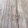 Megen Gabrielle Jewelry | circles necklace, chain and pendaendt circle necklace. 14k gold fill necklace. gold necklace. family necklace. loved ones necklace. necklace. significant other necklace
