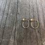 Megen Gabrielle Jewelry | rainbow earrings. 14k gold filled rainbow earrings. small rainbow earrings. U- shapped earrings. Small Sterling silver rainbow earrings. 14k rose gold filled rainbow earrings. rainbow shaped earrings.