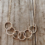 Megen Gabrielle Jewelry | circles necklace, chain and pendaendt circle necklace. 14k gold fill necklace. gold necklace. family necklace. loved ones necklace. necklace. significant other necklace