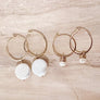 Megen Gabrielle Jewelry | 14k gold fill jewelry. 14k gold fill earrings, pearl earrings. gold and pearl earrings. dangle pearl earrings. coin pearl earrings. gold filled earrings, gold earrings. pearl earrings. pearl hoop earrings for women. pearl drop hoop earrings for women.