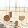 Megen Gabrielle Jewelry | 14K gold fill shine half moon necklace. 14k gold fill jewelry. 14k gold fill necklace. half moon necklace. gold half moon necklace, gold moon necklace, womens 14k gold fill necklace. gold half moon necklace for women. gold half moon necklace for ladies, moon necklace gold. womens moon gold necklace. 14k gold fill jewelry for women. gold filled jewelry.