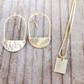 Megen Gabrielle Jewelry | 14k gold filled earrings. 14k gold fill earrings. gold earrings for women, gold earrings for ladies. gold filled jewelry. gold fill earrings. gold fill half moon earrings. drop hoop gold earrings. gold half moon drop hoop earrings. half moon hammered gold earrings. gold geometric shape earrings. gold geometric hammered hoop earrings. flat hammered gold hoop earrings. gold half moon hoop earrings.