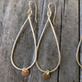 Megen Gabrielle Jewelry | teardrop-shaped hoop with gold disk drop.