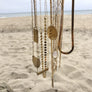 Megen Gabrielle Jewelry | gold disk necklace. gold disc necklace. gold fill circle necklace for women. gold circle necklace for women, gold pendant necklace for ladies. gold coin necklace for ladies. large gold coin necklace for women. large gold coin necklace.