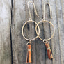 Megen Gabrielle Jewelry | handmade circle hoops with small leather tassel. Small hoop earrings. Earrings with leather. Hoop earrings with leather