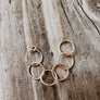 Megen Gabrielle Jewelry | circles necklace, chain and pendaendt circle necklace. 14k gold fill necklace. gold necklace. family necklace. loved ones necklace. necklace. significant other necklace