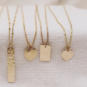 Megen Gabrielle Jewelry | rectangle layering necklace 14k gold fill layering necklace, necklace with rectangle. necklace with shape. 14k gold fill rectangle necklace. geometric necklace. hammered gold rectangle necklace. necklace with texture. 14K gold fill necklaces.  Rectanlge pendant necklace. horizontal necklace pendant. vertical rectangle pendant necklace. long rectangle pendant necklace