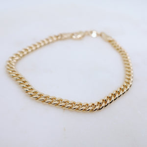 Megen Gabrielle Jewelry | 18k gold fill bracelet, gold fill bracelet, gold filled bracelet. women's gold bracelet. 18k gold filled bracelet cuban. 18k gold filled bracelet curb chain. womens gold bracelet. mens gold bracelet. gold bracelet for ladies. curb chain bracelet. Cuban chain bracelet. curb chain vs cuban link. mens gold chain. mens cuban chain bracelet. womens cuban chain bracelet. diamond cut maimi cuban chain