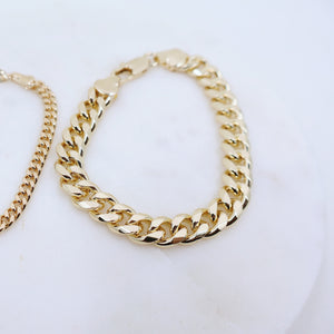 Megen Gabrielle Jewelry | 18k gold fill bracelet, gold fill bracelet, gold filled bracelet. women's gold bracelet. 18k gold filled bracelet cuban. 18k gold filled bracelet curb chain. womens gold bracelet. mens gold bracelet. gold bracelet for ladies. curb chain bracelet. Cuban chain bracelet. curb chain vs cuban link. mens gold chain. mens cuban chain bracelet. womens cuban chain bracelet.