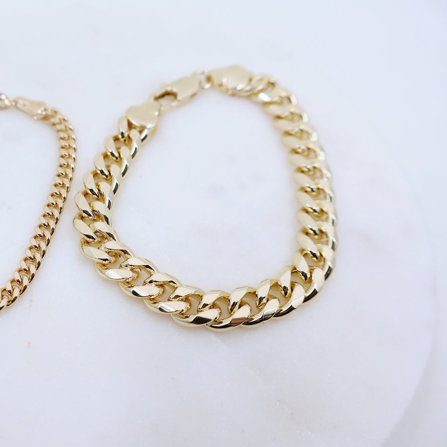 Megen Gabrielle Jewelry | 18k gold fill bracelet, gold fill bracelet, gold filled bracelet. women's gold bracelet. 18k gold filled bracelet cuban. 18k gold filled bracelet curb chain. womens gold bracelet. mens gold bracelet. gold bracelet for ladies. curb chain bracelet. Cuban chain bracelet. curb chain vs cuban link. mens gold chain. mens cuban chain bracelet. womens cuban chain bracelet.