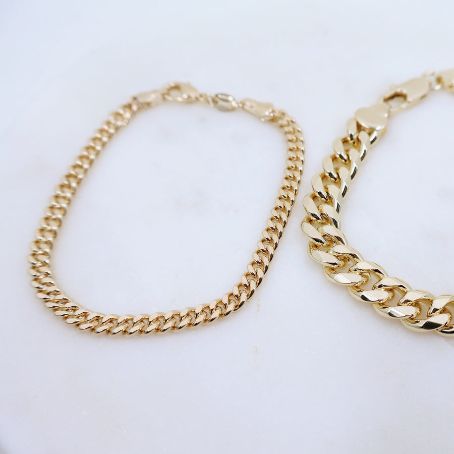 Megen Gabrielle Jewelry | 18k gold fill bracelet, gold fill bracelet, gold filled bracelet. women's gold bracelet. 18k gold filled bracelet cuban. 18k gold filled bracelet curb chain. womens gold bracelet. mens gold bracelet. gold bracelet for ladies. curb chain bracelet. Cuban chain bracelet. curb chain vs cuban link. mens gold chain. mens cuban chain bracelet. womens cuban chain bracelet.