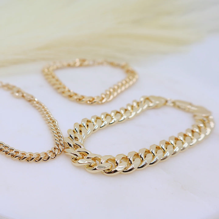 Megen Gabrielle Jewelry | 18k gold fill bracelet, gold fill bracelet, gold filled bracelet. women's gold bracelet. 18k gold filled bracelet cuban. 18k gold filled bracelet curb chain. womens gold bracelet. mens gold bracelet. gold bracelet for ladies. curb chain bracelet. Cuban chain bracelet. curb chain vs cuban link. mens gold chain. mens cuban chain bracelet. womens cuban chain bracelet.
