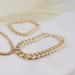 Megen Gabrielle Jewelry | 18k gold fill bracelet, gold fill bracelet, gold filled bracelet. women's gold bracelet. 18k gold filled bracelet cuban. 18k gold filled bracelet curb chain. womens gold bracelet. mens gold bracelet. gold bracelet for ladies. curb chain bracelet. Cuban chain bracelet. curb chain vs cuban link. mens gold chain. mens cuban chain bracelet. womens cuban chain bracelet.