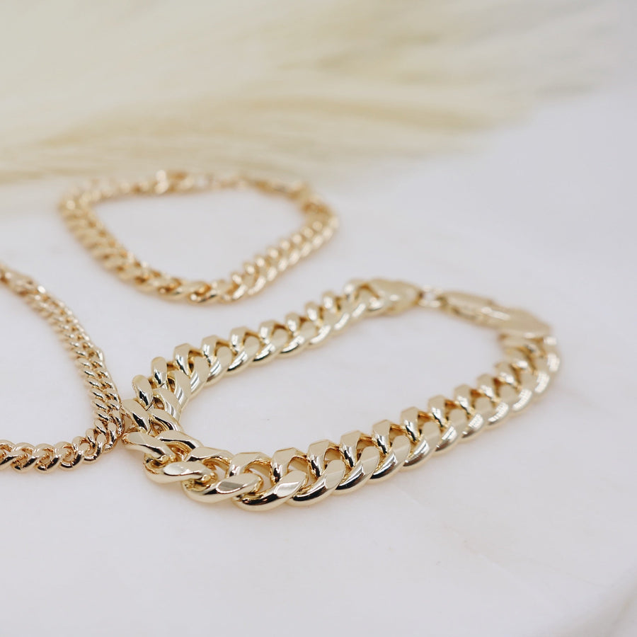 Megen Gabrielle Jewelry | 18k gold fill bracelet, gold fill bracelet, gold filled bracelet. women's gold bracelet. 18k gold filled bracelet cuban. 18k gold filled bracelet curb chain. womens gold bracelet. mens gold bracelet. gold bracelet for ladies. curb chain bracelet. Cuban chain bracelet. curb chain vs cuban link. mens gold chain. mens cuban chain bracelet. womens cuban chain bracelet.