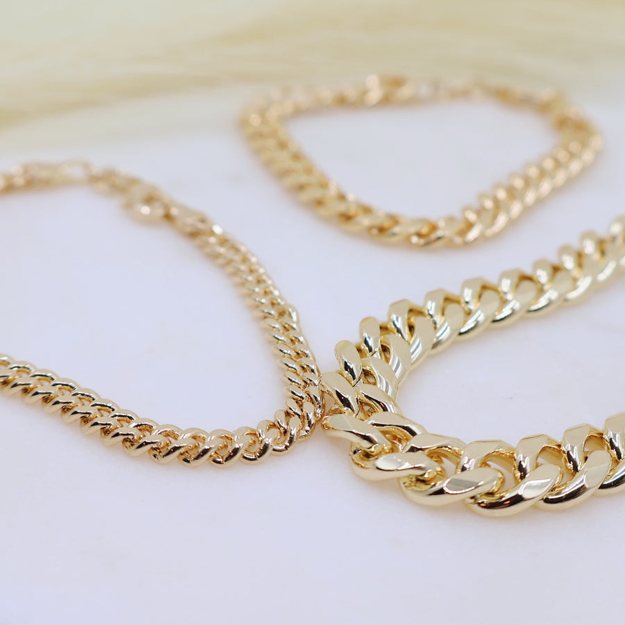 Megen Gabrielle Jewelry | 18k gold fill bracelet, gold fill bracelet, gold filled bracelet. women's gold bracelet. 18k gold filled bracelet cuban. 18k gold filled bracelet curb chain. womens gold bracelet. mens gold bracelet. gold bracelet for ladies. curb chain bracelet. Cuban chain bracelet. curb chain vs cuban link. mens gold chain. mens cuban chain bracelet. womens cuban chain bracelet. diamond cut cuban miami chain