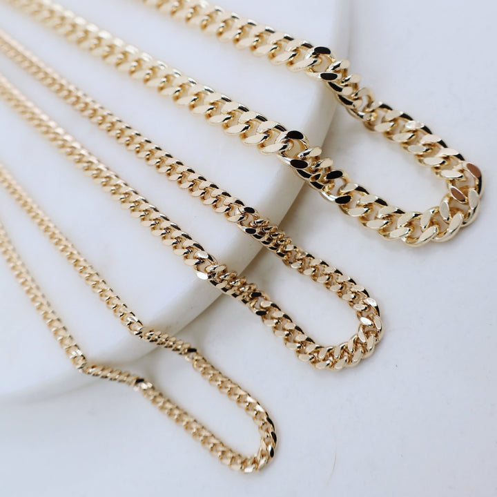 Megen Gabrielle Jewelry | Curb Chain necklace. gold fill necklace, 18k gold fill necklace, gold filled necklace, 18k gold fill necklace, Curb chain 18k gold fill. curb chain 14k gold fill.  curb chain necklace. cuban chain necklace. curb chain necklace gold. Cuban chain necklace. womens gold chain necklace. Thick curb chain necklace. Thin curb chain necklace. Thick cuban chain necklace. thin cuban chain necklace.