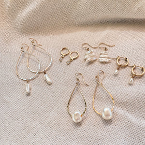 Megen Gabrielle Jewelry | 14k gold fill jewelry. 14k gold fill earrings, pearl earrings. gold and pearl earrings. dangle pearl earrings. coin pearl earrings. gold filled earrings, gold earrings. pearl earrings. pearl hoop earrings for women. pearl drop hoop earrings for women. 