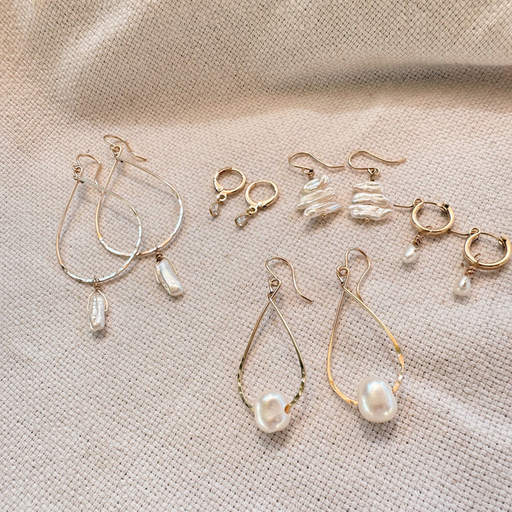 Megen Gabrielle Jewelry | 14k gold fill jewelry. 14k gold fill earrings, pearl earrings. gold and pearl earrings. dangle pearl earrings. coin pearl earrings. gold filled earrings, gold earrings. pearl earrings. pearl hoop earrings for women. pearl drop hoop earrings for women. 