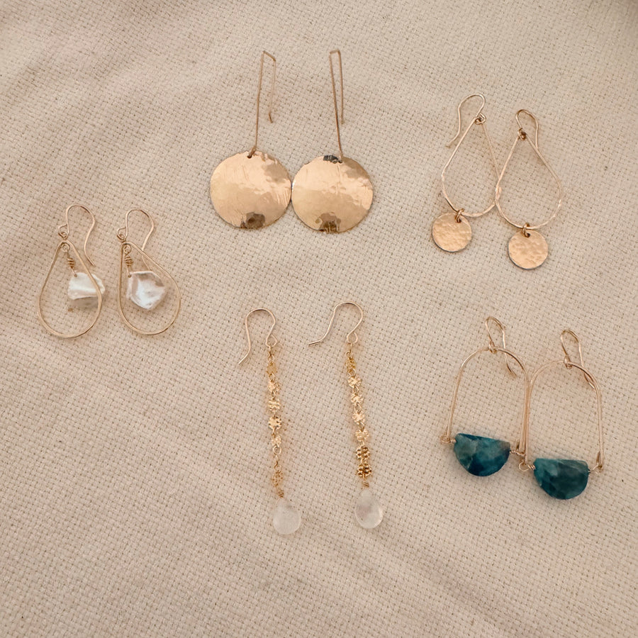 Megen Gabrielle Jewelry | 14k gold fill jewelry. 14k gold fill earrings, pearl earrings. gold and pearl earrings. dangle pearl earrings. coin pearl earrings. gold filled earrings, gold earrings. pearl earrings. gold hoop earrings for women. pearl drop hoop earrings for women. 