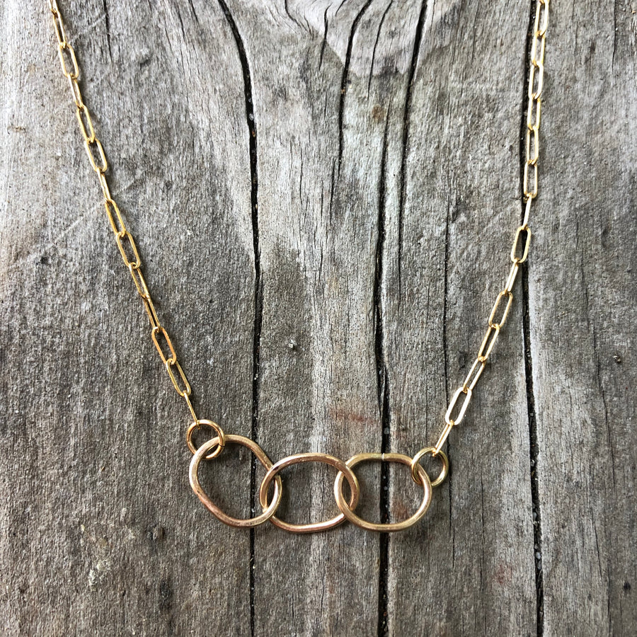 Megen Gabrielle Jewelry | circles necklace, chain and pendaendt circle necklace. 14k gold fill necklace. gold necklace. family necklace. loved ones necklace. necklace. significant other necklace
