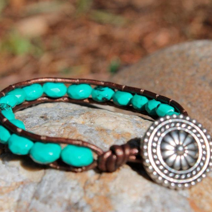 Megen Gabrielle Jewelry | Beaded woven wrap bracelet. Turquoise colored beads and silver medallion style button for closure. 