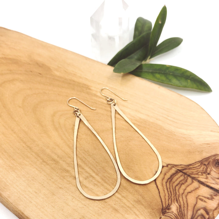 Megen Gabrielle Jewelry | Tear drop hoop earrings in 14k gold filled. Handmade and hammered for texture. 