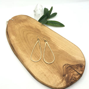 Megen Gabrielle Jewelry | Tear drop hoop earrings in 14k gold filled. Handmade and hammered for texture. 