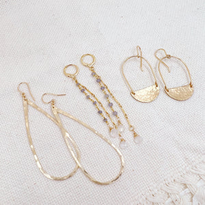 Megen Gabrielle Jewelry Studios | iolite earrings. iolite gemstone earrings. Iolite and moonstone dangle earrings. drop earrings. elegant earrings. 14K gold fill earrings. drop dangle earrings. moonstone earrings. 