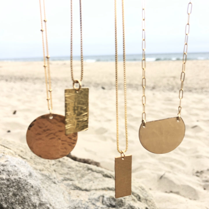 Megen Gabrielle Jewelry | gold disk necklace. gold disc necklace. gold fill circle necklace for women. gold circle necklace for women, gold pendant necklace for ladies. gold coin necklace for ladies. large gold coin necklace for women. large gold coin necklace.