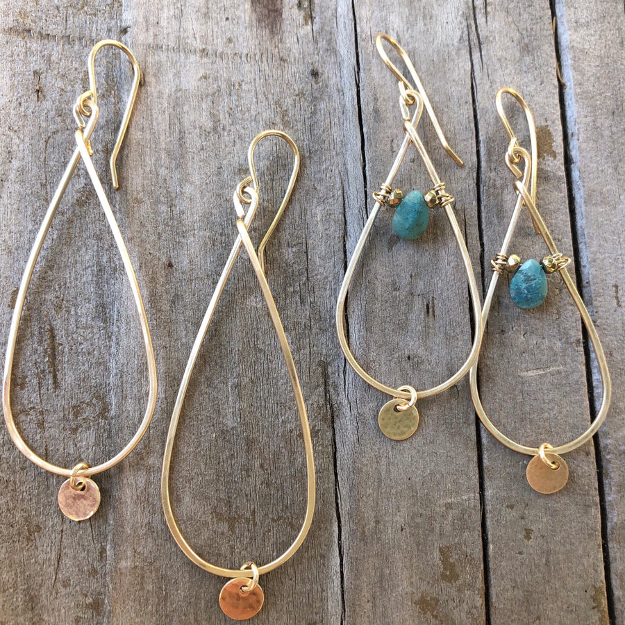 Megen Gabrielle Jewelry | teardrop-shaped hoop with gold disk drop and another pair of hoops wire wrapped with a chrysocolla stone and has a little circle drop as-well. 